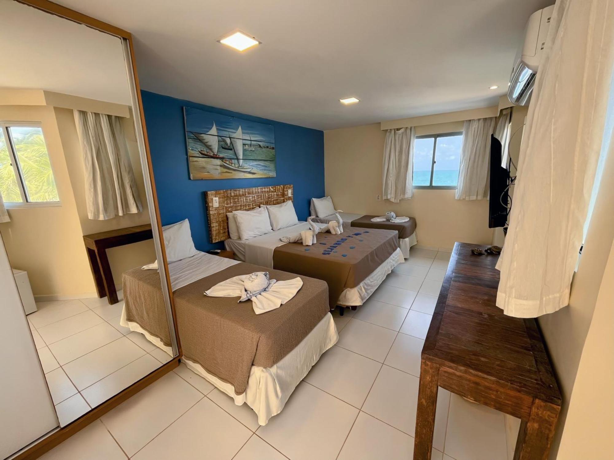 Quarto Quádruplo com Vista do Mar.
